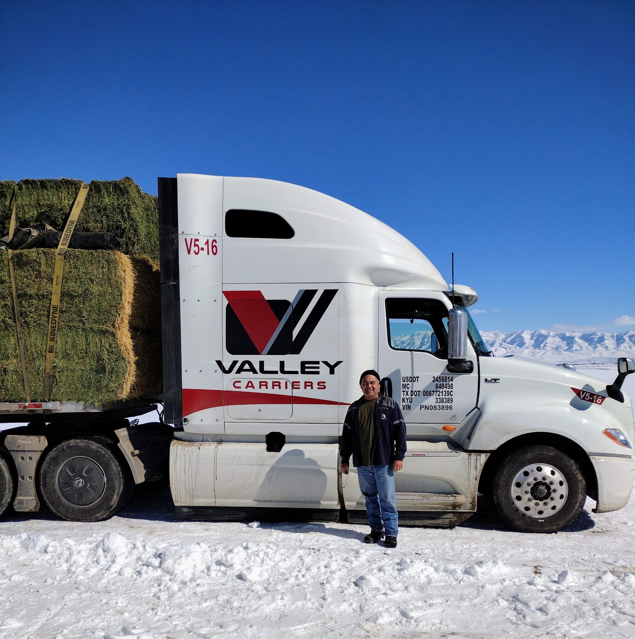 A Valley Carriers driver beside his tractor on a northern run